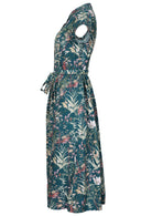 Side view of 50's style teal based floral midi length dress with hidden side pockets and a waist tie